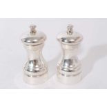 Pair of contemporary silver pepper grinders