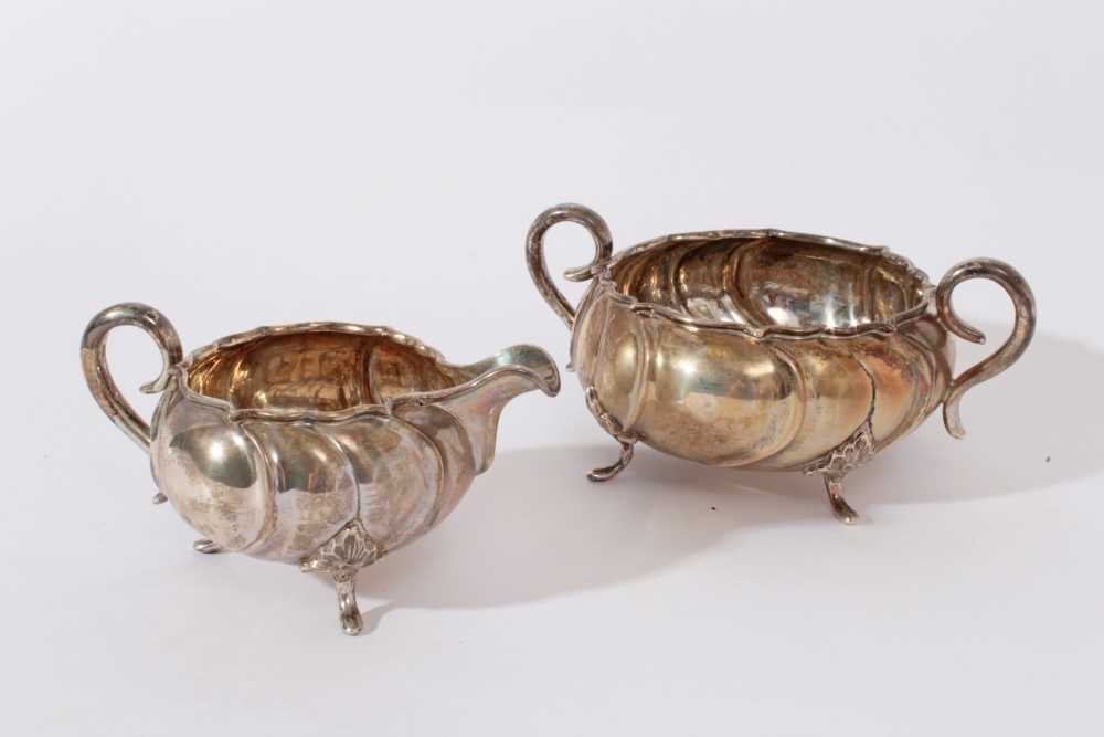 Early 20th Century Danish silver sugar bowl and milk jug, with wrythen decoration and scroll handles