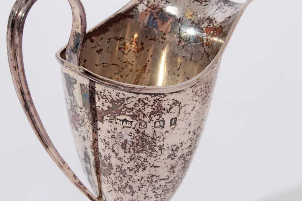 Edwardian silver cream jug of helmet form with loop handle (Birmingham 1905) together with a 1920's - Image 3 of 5