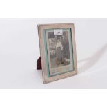 Contemporary silver photograph frame of rectangular form with reeded decoration and beaded borders w