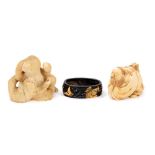 Two Japanese ivory netsukes and gilt bronze sword fitting