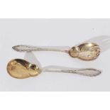Pair of early 20th Century Danish silver salad servers, with rope twist decoration, gilded bowls and