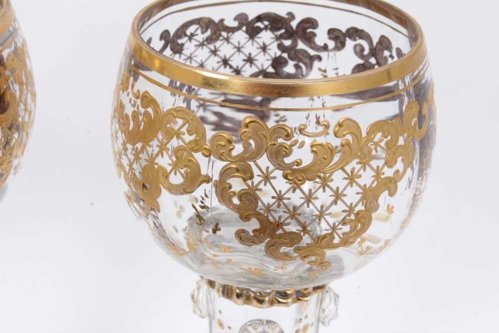 Fine set of nine 19th century Bohemian glass goblets, the round bowls on hollow raspberry-prunted st - Image 2 of 3