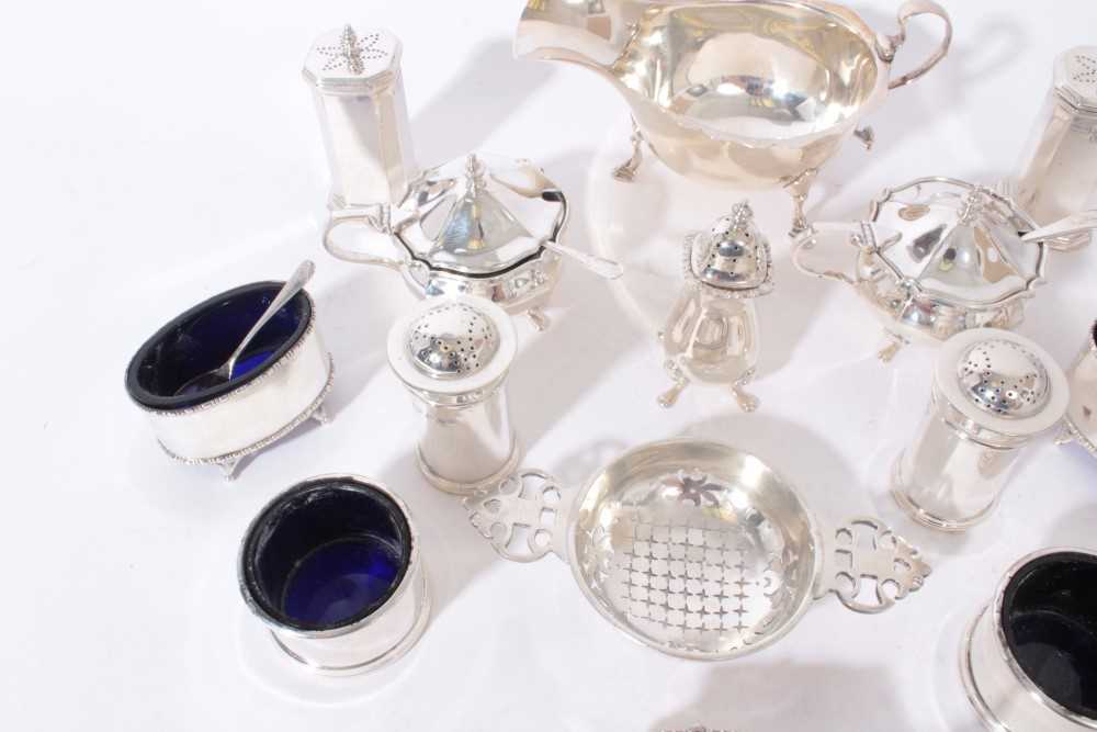 Group of silver condiments to include five salts with blue glass liners, two pairs of pepperettes, p - Image 4 of 4
