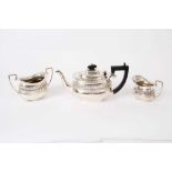 George V silver three piece bachelor's tea set, comprising teapot of compressed baluster form, with