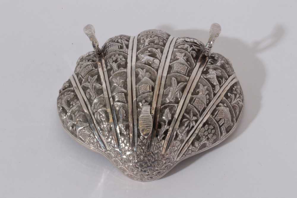Late 19th / early 20th century Burmese silver dish of shell form, with embossed decoration, raised o - Image 3 of 3