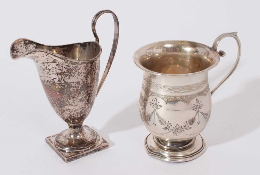 Edwardian silver cream jug of helmet form with loop handle (Birmingham 1905) together with a 1920's