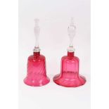 Two Victorian cranberry tinted glass bells
