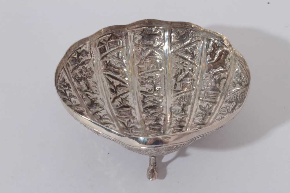 Late 19th / early 20th century Burmese silver dish of shell form, with embossed decoration, raised o - Image 2 of 3