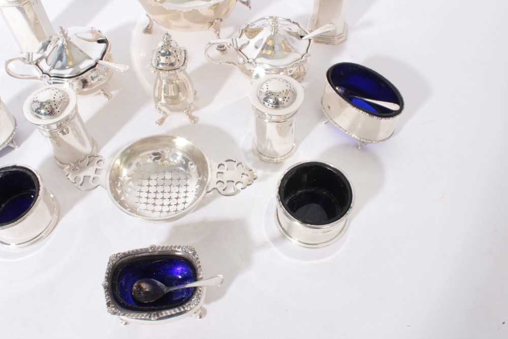 Group of silver condiments to include five salts with blue glass liners, two pairs of pepperettes, p - Image 3 of 4