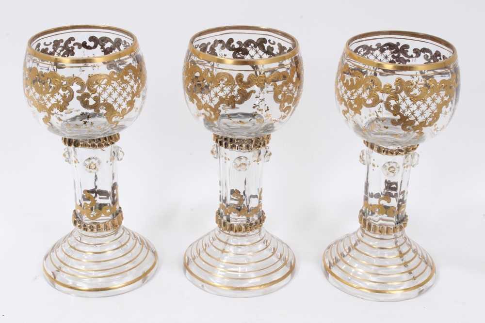 Fine set of nine 19th century Bohemian glass goblets, the round bowls on hollow raspberry-prunted st