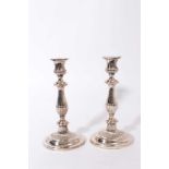 Pair of Regency silver plated candlesticks with oval fluted stems