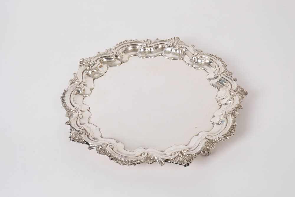 Good Quality Contemporary silver salver with scroll border, raised on three scroll feet, (Birmingham