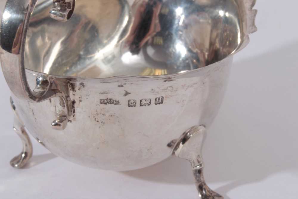 George V silver sauce boat of helmet form, raised on three hoof feet, (Birmingham 1915) together wit - Image 3 of 11