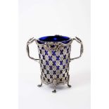 Edwardian silver sugar basket with pierced decoration, scroll borders and twin handles modelled as G