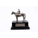 Silver horse and jokey mounted on ebosnised wooden base