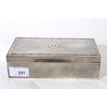 George V silver cigarette box of rectangular form with engined turned decoration, hinged lid with Gr