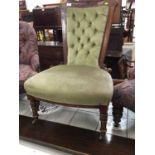 Edwardian walnut nursing chair with green buttoned upholstery