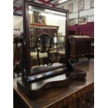 Late Victorian mahogany framed swing toilet mirror and a painted mantel mirror with arched top (2)