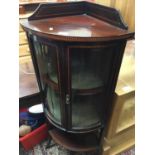 Edwardian inlaid mahogany corner cabinet with undertier and splayed legs