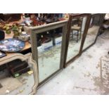 Four large framed wall mirrors
