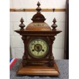 Walnut mantle clock with brass decoration