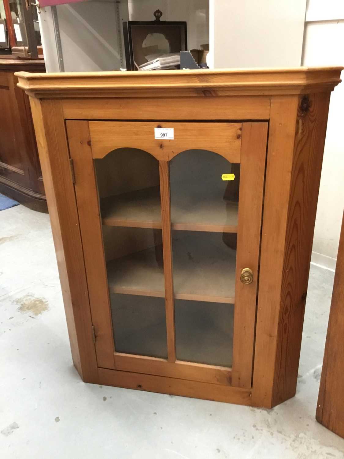 Stained pine hanging corner cabinet with glazed door
