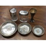 Two silver topped glass jars, small silver beaker and three Eastern white metal pin dishes