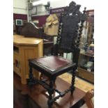 Victorian carved oak hall chair with embossed leather back