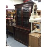 Edwardian walnut two height bookcase with two leaded glazed doors, drawer and two panelled doors bel