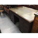 19th century oak partners desk with leather lined top and 18 drawers with brass knob handles raised