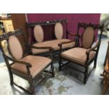 1920s oak Carolean revival carved settee and two matching arm chairs with pierced crestings on turne