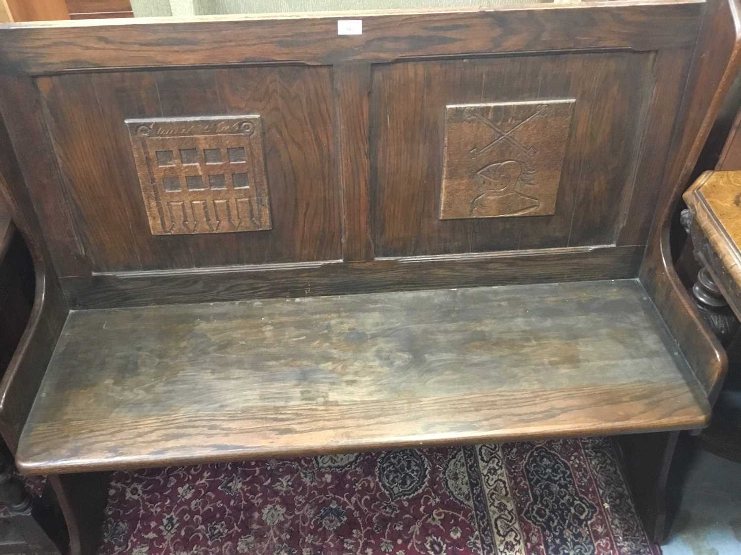 Oak hall bench with carved panels