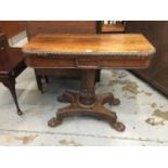 Regency rosewood card table with fold over top and baize lined interior on inverted tulip column,qua