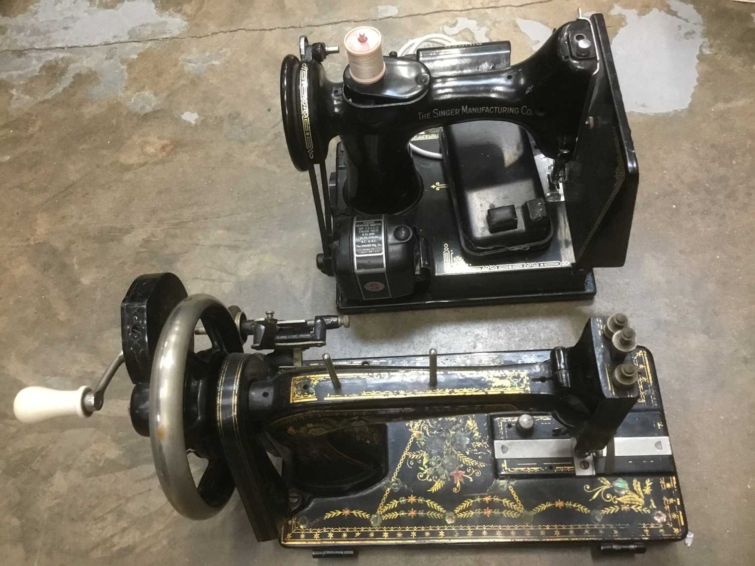 Two antique sewing machines.