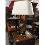 Decorative table lamp with enamelled bird mount and white shade