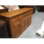 Victorian pine dresser base with three drawers and cupboards below