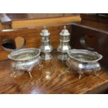 Pair of silver pepperettes together with a pair of silver salts (4)