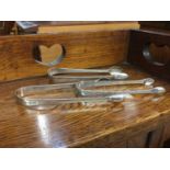 Three pairs of Georgian silver sugar tongs