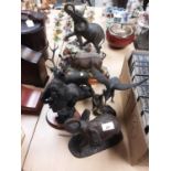 Group of four bronzed resin animal ornaments