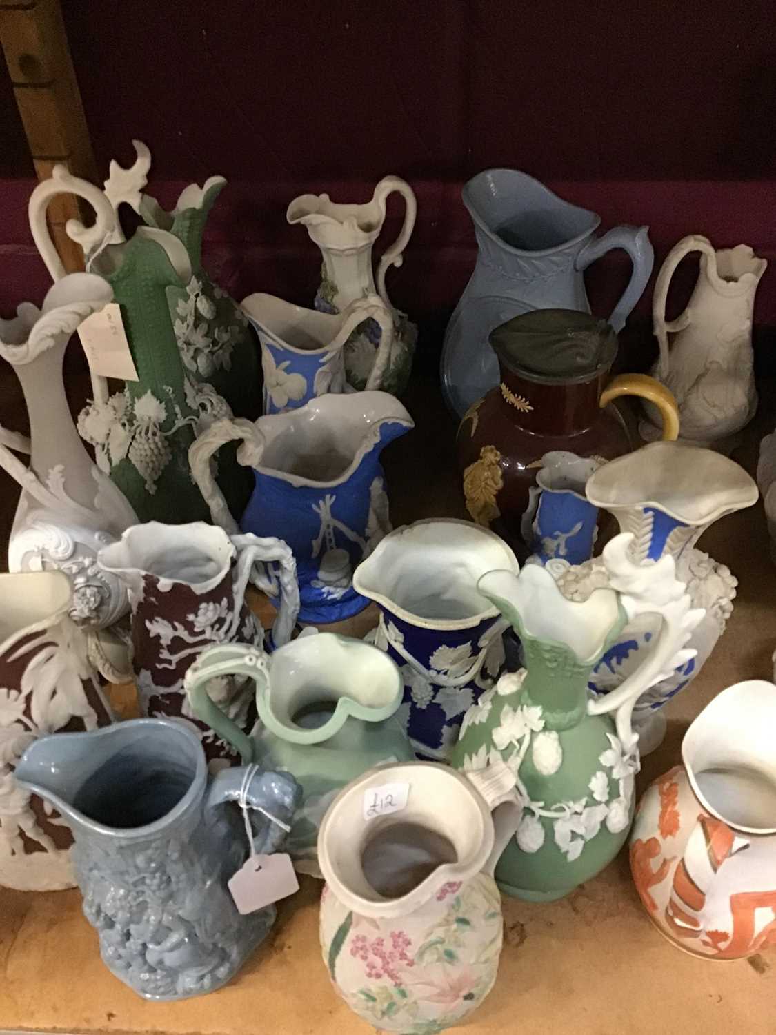 Collection of Victorian coloured relief moulded jugs