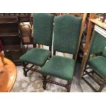 Pair Oak Carolean revival high back chair with green heraldic upholstery