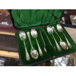 Set of six silver teaspoons in fitted case with sugar tongs