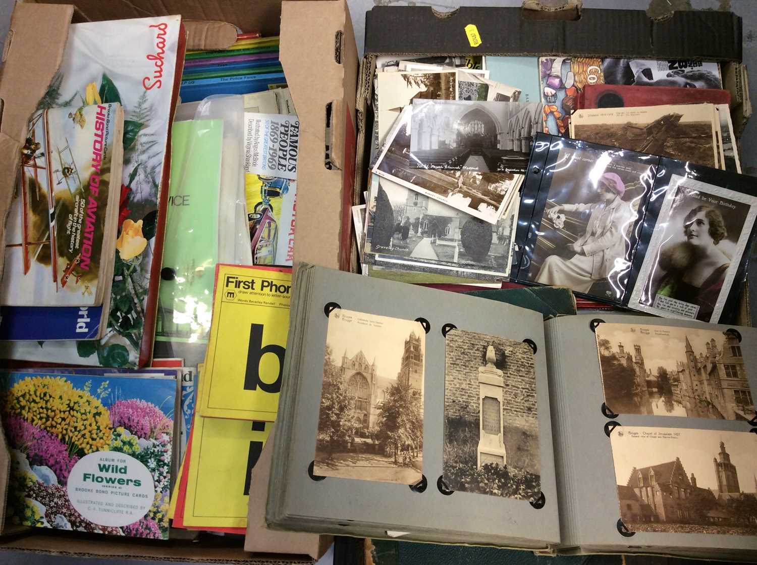 Two boxes ephemera including cigarette card booklets, postcard albums etc
