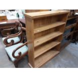 Pine open bookcase and a contemporary oak cupboard