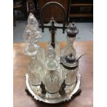 Victorian silver plated six bottle cruet frame with cut glass bottles