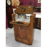 Art Deco figured and cross-banded walnut veneered cocktail cabinet with cantilever mechanism opening