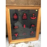 Royal Navy cloth badges mounted in two glazed frames