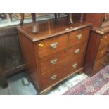 Edwardian walnut chest of two short and two long drawers