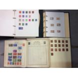 Four world stamp albums including Victorian penny reds etc